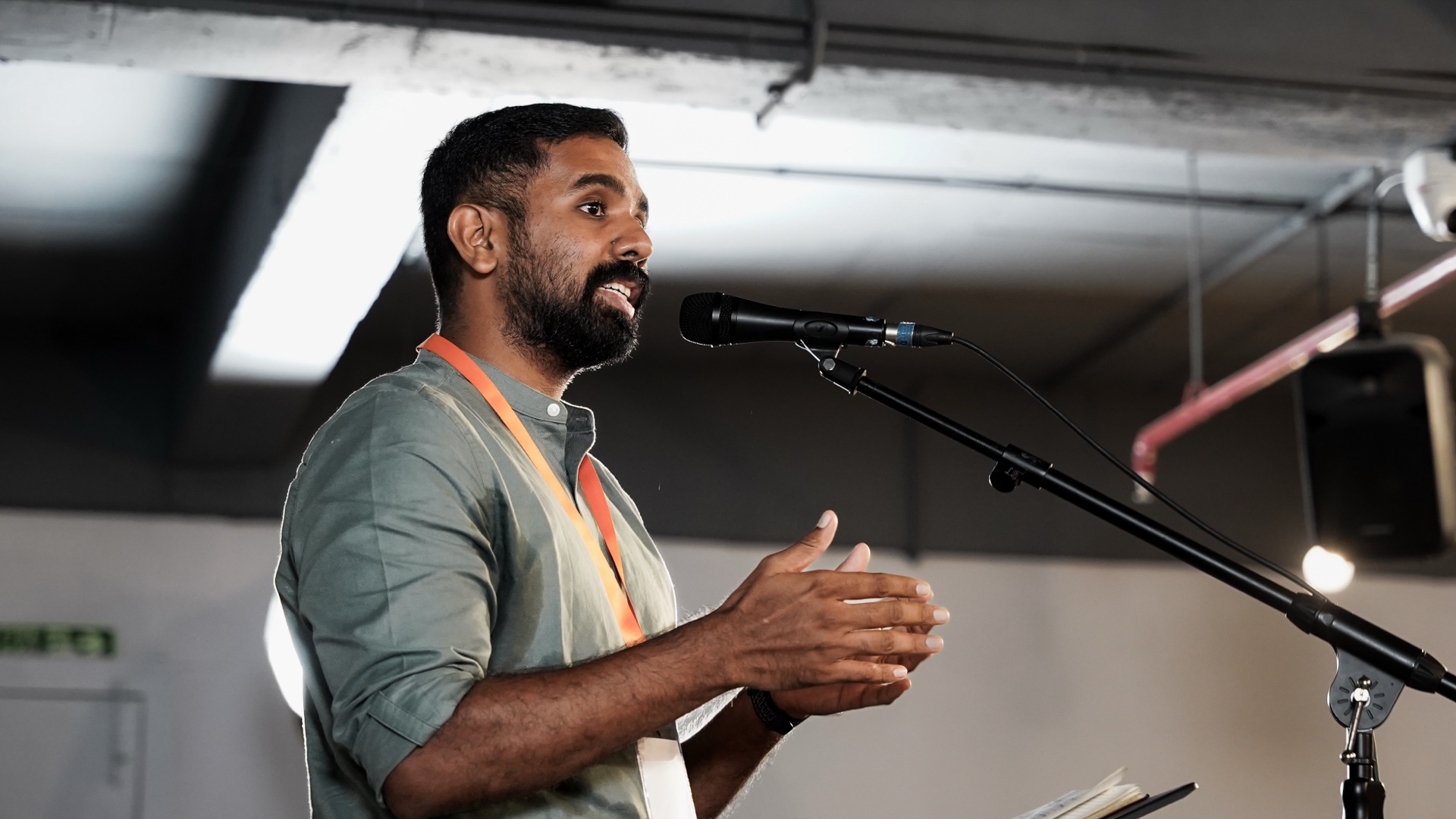 Joy Corp conference speaker presenting on stage