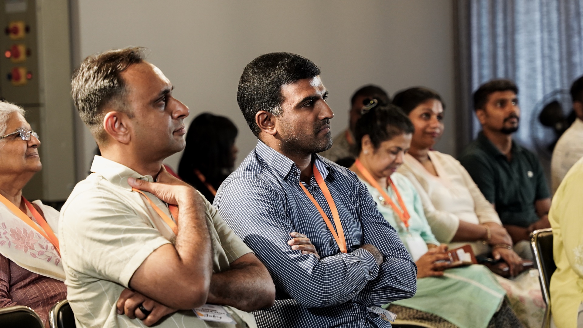Joy Corp conference attendees listening during a session