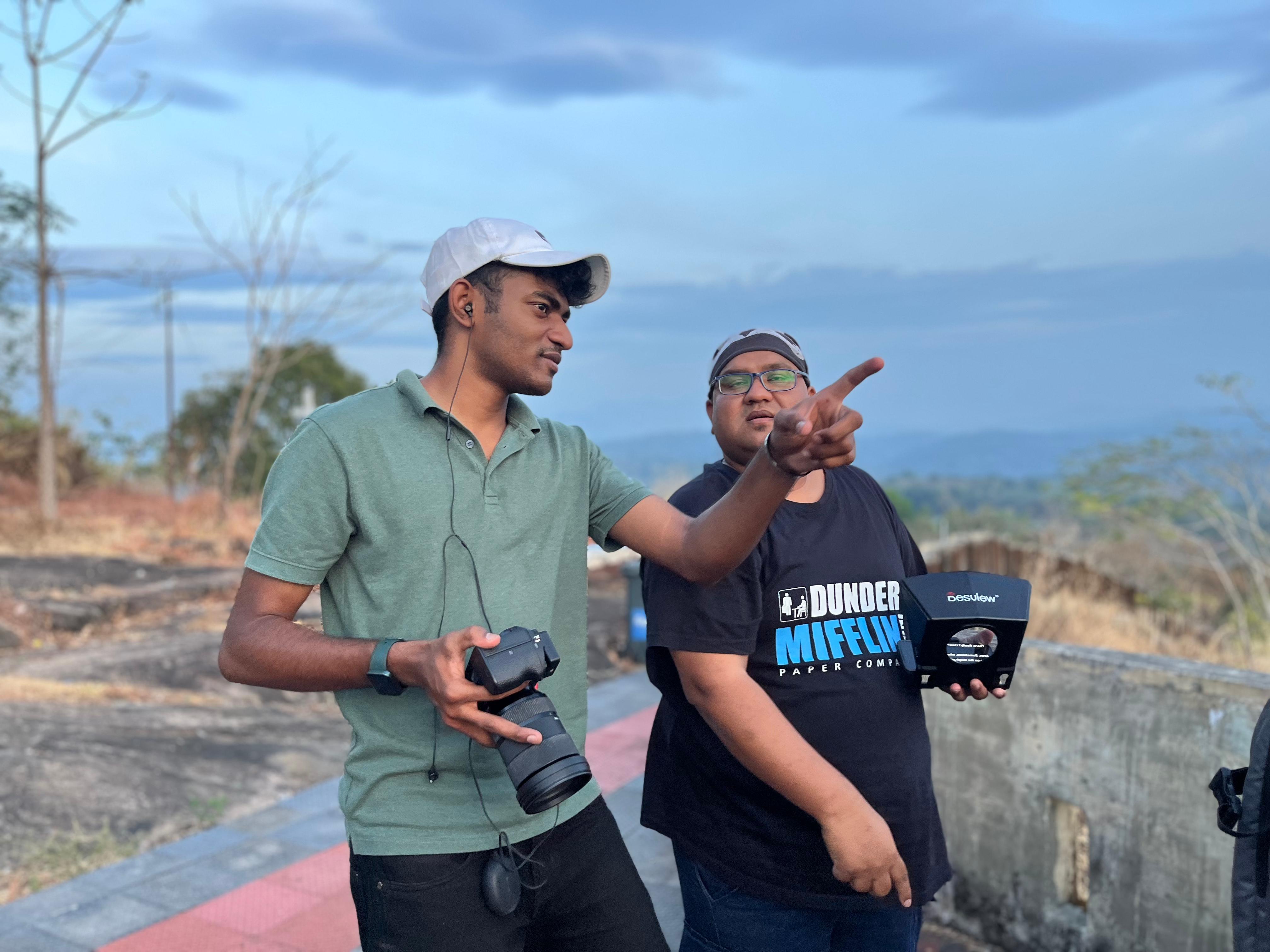 Alin and a creative collaborator directing an outdoor scene